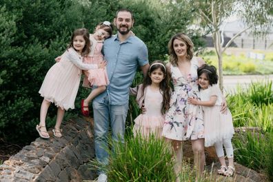 Samantha (right) with her twin Alexandra, parents and siblings.