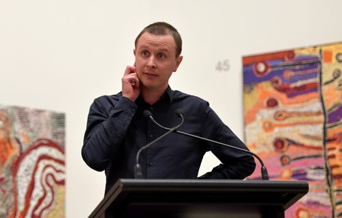 With his portrait at the Art Gallery of New South Wales in Sydney. (AAP)