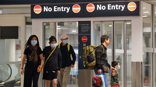 Australian evacuees who were quarantined on Christmas Island over concerns about the COVID-19 coronavirus arrive at Sydney Airport in Sydney, Monday, February 17, 2020. The bulk of the people quarantined on Christmas Island have been flown to the mainland on two aircraft while about 35 people will return the day after tomorrow. 