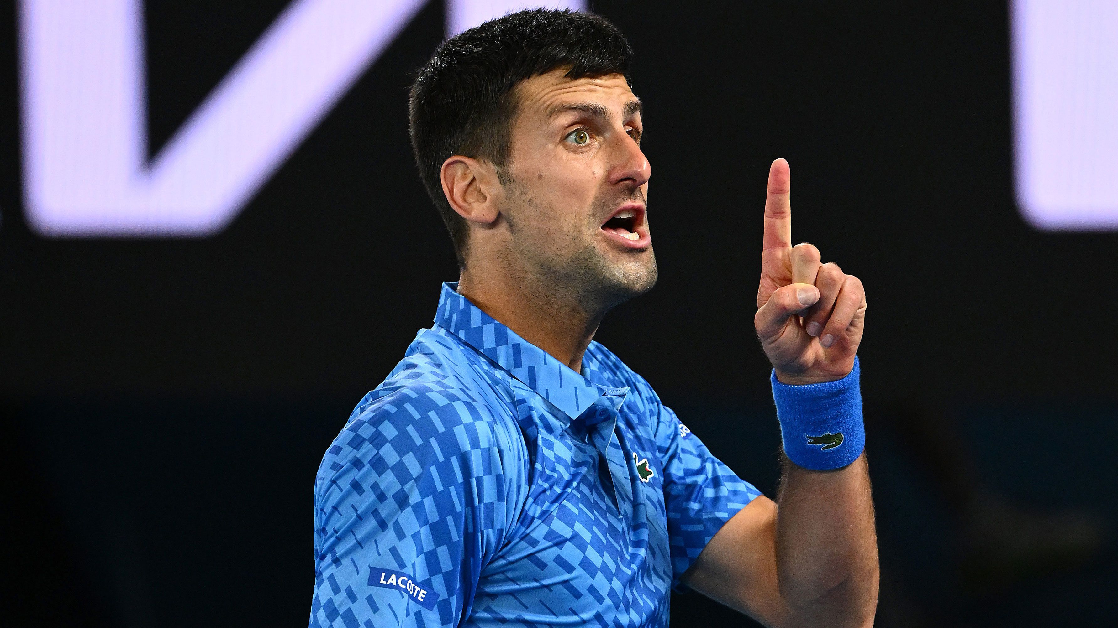 Novak Djokovic reacts during his third round Australian Open singles match against Grigor Dimitrov.