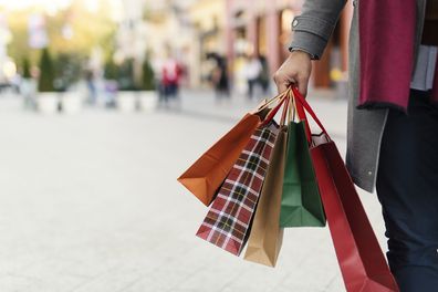 Man carrying shopping bags for Christmas