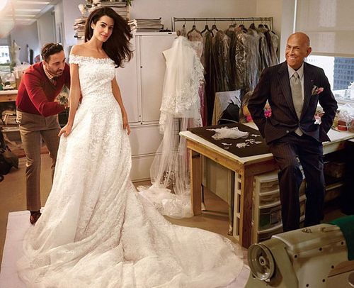 Oscar De La Renta poses at the final wedding dress fitting of Amal Clooney, who wed in Venice this month. (Vogue)