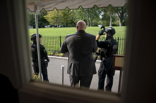 Member of the US Secret Service stand outside the James Brady Press Briefing Room at the White House, as a news conference by President Donald Trump was paused by a security incident outside the fence of the White House.
