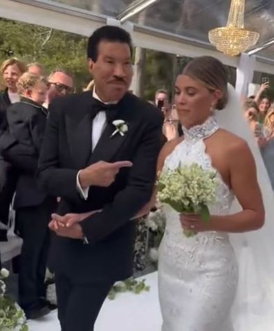 Lionel Richie walking Sofia down the aisle