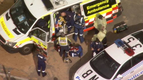 Emergency teams attend to the injured surfer, said to be in his 40s.