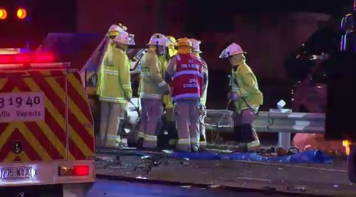 Emergency crews working to clean up the scene in Ipswich Rd last night. Picture: 9NEWS