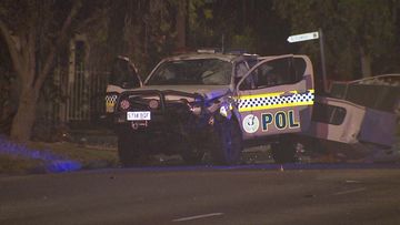 A﻿ marked police car has rolled &quot;several times&quot; after a Ford sedan crashed into it on a suburban street in Victor Harbor in Adelaide&#x27;s south.