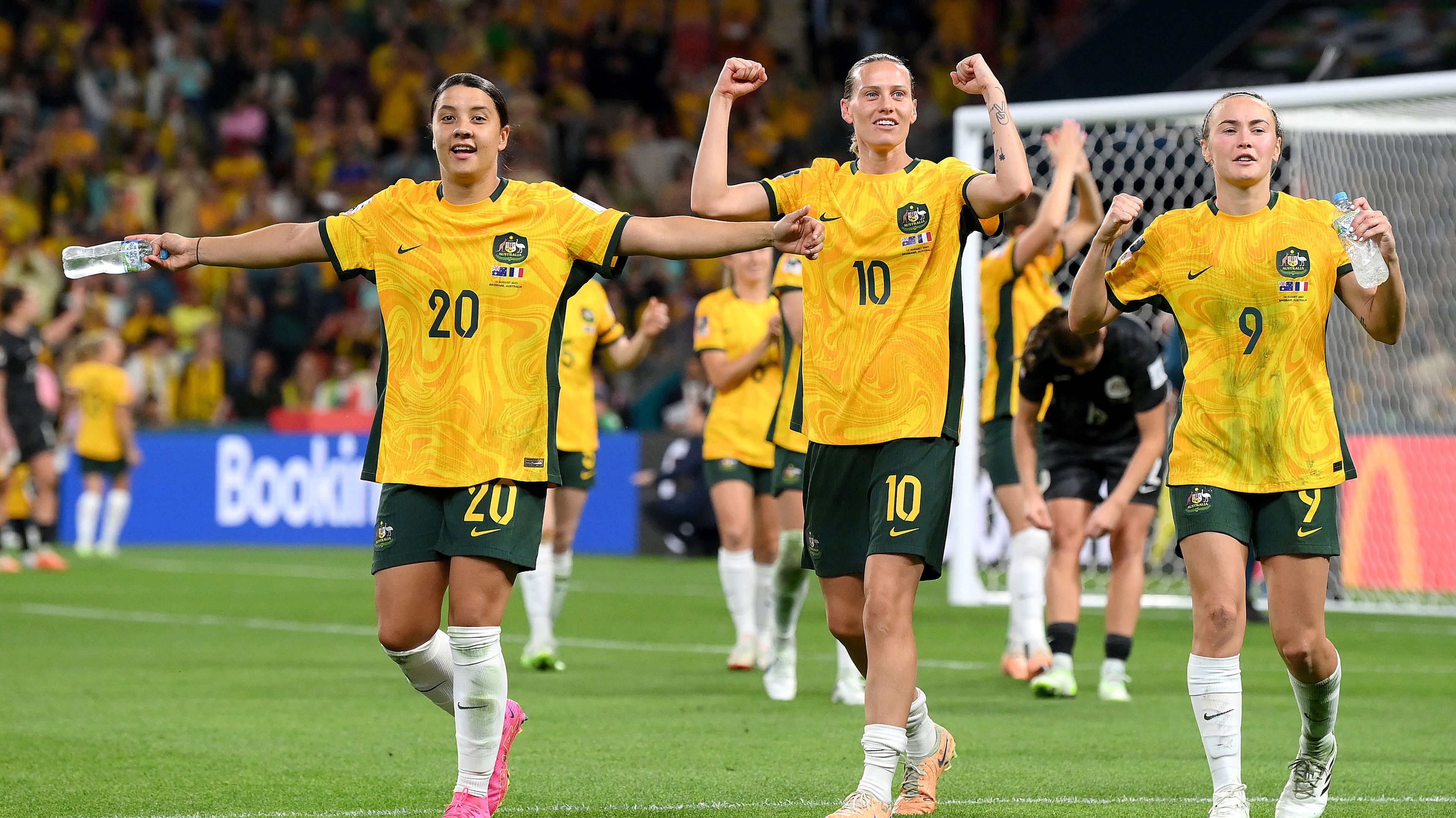 Sam Kerr, Emily van Egmond and Caitlin Foord of Australia applaud fans after the Matildas&#x27; victory against France via a World Cup quarter-final penalty shootout.