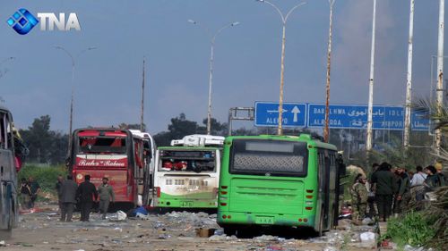Buses at the evacuation point where an explosion hit at the Rashideen area, a rebel-controlled district outside Aleppo city. (AAP)