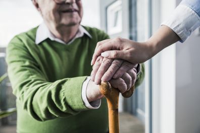 Elderly man with walking stick