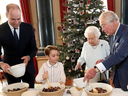 Prince George mixing a Christmas pudding with Prince William, Prince Charles and Queen Elizabeth II