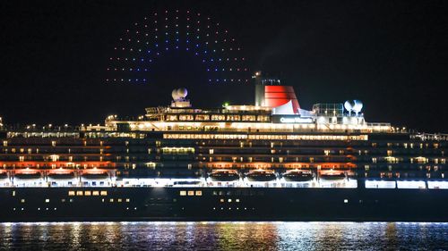 The Queen Victoria ship sails into Sydney Harbour with a special Pride-themed drone show.