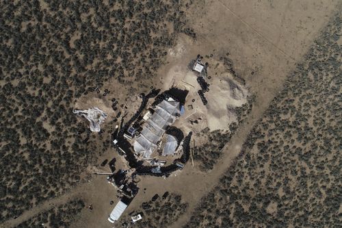 An aerial view shows a makeshift compound in the desert area of Amalia, N.M.