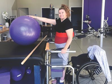 Allison Wilcox doing physical therapy with Making Strides.