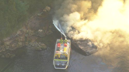A man has been hurt in a boat fire in Sydney.