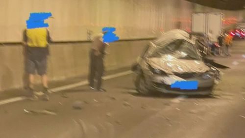 Two people have died and two others have been hospitalised after a three-vehicle crash in a major ﻿Brisbane tunnel.
