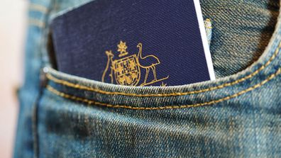 Australian passport in jeans pocket, close up.