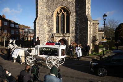 A white horse drawn hearse arrives for the funeral of singer Liam Payne