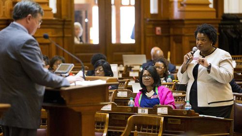 Stacey Abrams (right) speaks in the Georgia House of Representatives. (AP)