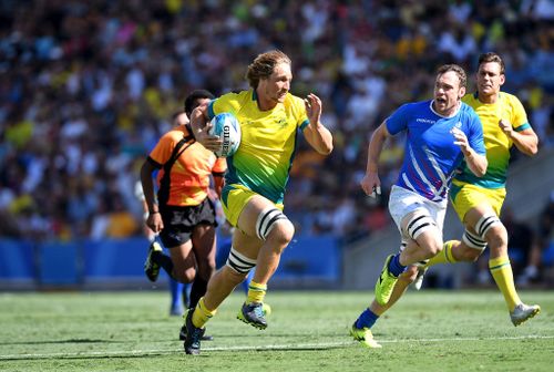 Jesse Parahi of Australia breaks away from the defence in the match between Australia and Scotland. (Getty)