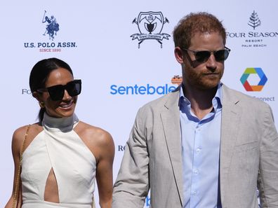 Prince Harry and Meghan Markle, Duchess of Sussex, pose for photos at the 2024 Royal Salute Polo Challenge to Benefit Sentebale, Friday, April 12, 2024, in Wellington, Florida