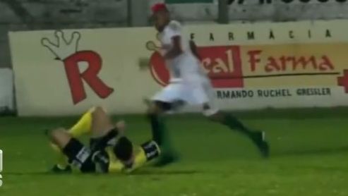 Footballer William Ribeiro attacks the referee.