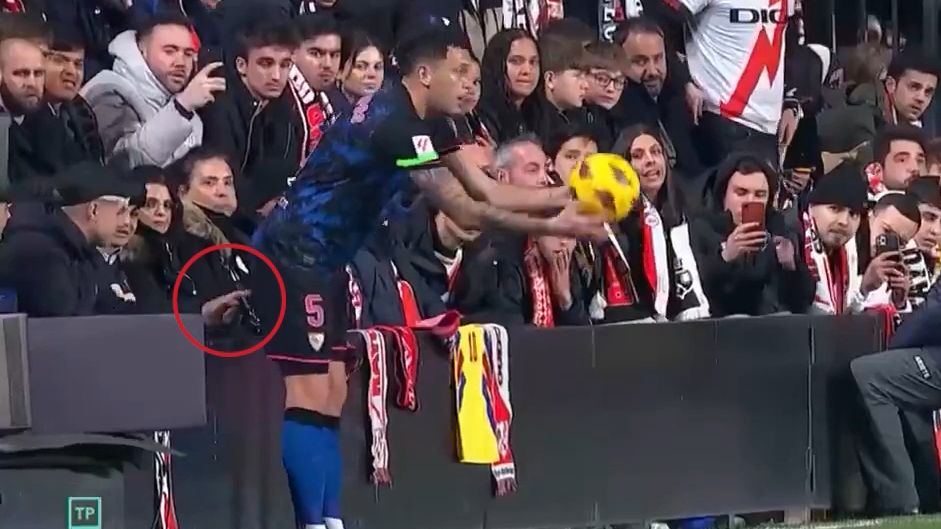 Lucas Ocampos had his backside poked by an opposing fan while taking a throw-in during Sevilla&#x27;s match against Rayo.