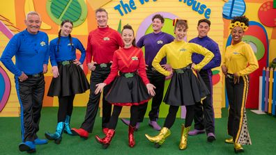 The Wiggles' modern lineup, including Anthony Field (left) and the first woman of colour in the main cast Tsehay Hawkins (right).