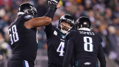 Aussie Jordan Mailata (left) celebrates with Jake Elliott and Aussie punter Arryn Siposs as they played for the Philadelphia Eagles against the Green Bay Packers in November 2022.