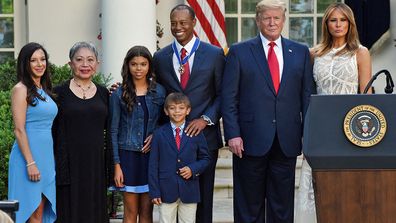 Tiger Woods with his family and Donald Trump