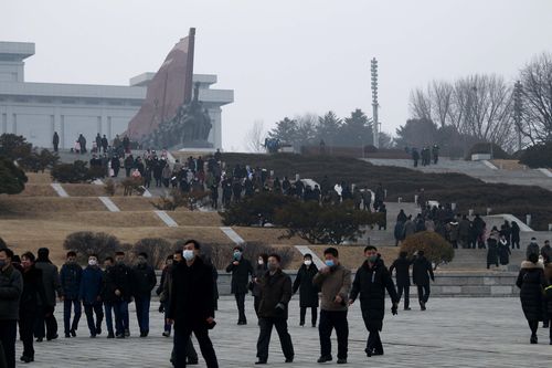 Citizens visit the statues of President Kim Il Sung and Chairman Kim Jong Il on Mansu Hill