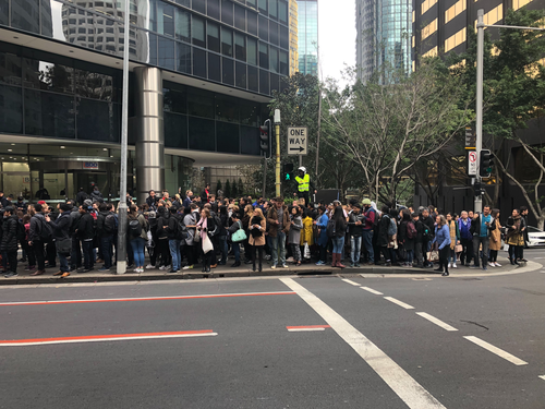 Commuters are lining up down the streets waiting for replacement busses. 