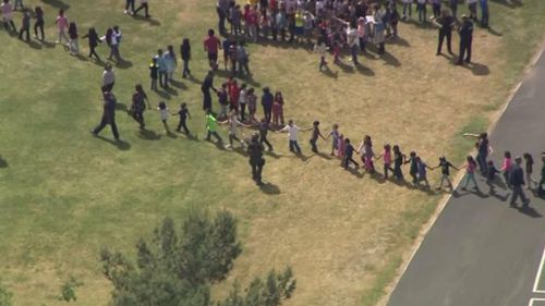 Students are evacuated after a shooting at a US elementary school. (Twitter)