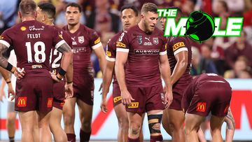 Queensland players react after conceding a try.