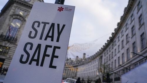 A sign reading Stay safe in Regent Street, in London, Friday, Nov. 26, 2021. 