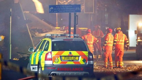 Members of the emergency services at the scene of the explosion which destroyed a property in Hinckley Road, Leicester. (AAP)