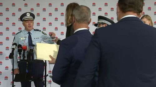 The Commissioner warned him 'don't come near me' before NSW Police removed the man.