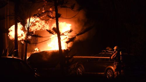 Firefighters faced strong westerly gusts as they attempted to battle the blaze. (AAP)