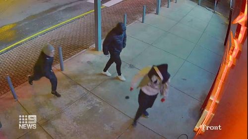 CCTV captured the three robbers smashing their way into the shop's showroom. 