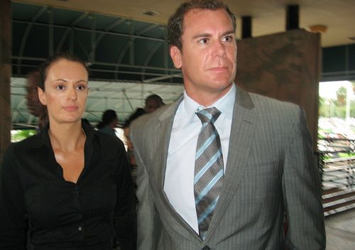 Former AFL star Wayne Carey (right) and his girlfriend Kate Neilson leave Miami-Dade County Court in Florida after pleading guilty to battery on a law enforcement officer, Oct. 14, 2008. Carey has been sentenced to community service, counselling and two years probation. 