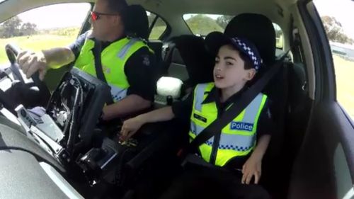 The 10-year-old was at home in the Highway Patrol car. (9NEWS)
