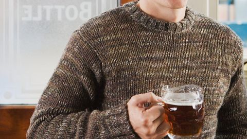 Man drinking beer in pub