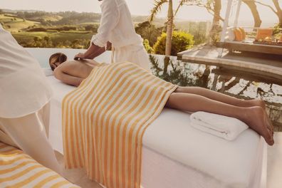 Hotel Clicquot - Woman getting massage by the pool