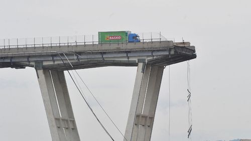 The driver of this supermarket delivery truck narrowly avoided plunging from the bridge as it crumbled.