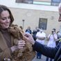William and Kate have cute moment with therapy puppy