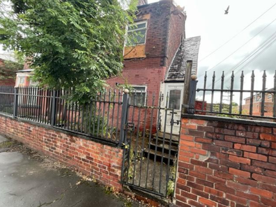 A rundown flat in Manchester without stairs has gone on the market, with a price guide of $39,703