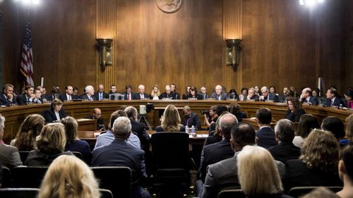 Christine Blasey Ford faces the Senate Judiciary Committee, Republicans on the left, Democrats on the right.