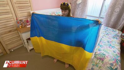 Ukrainian child's solo journey to seek safe haven in Australia.
