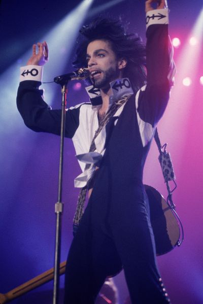 Performing in 1990 wearing a suit emblazoned with the foundations for his distinctive "Love Symbol".