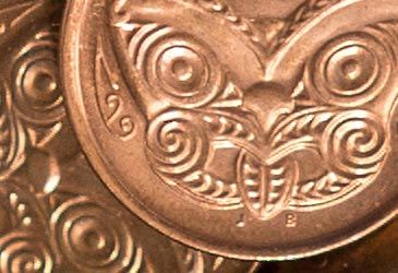 Which New Zealand coin is stamped with a carved mask (koruru)?